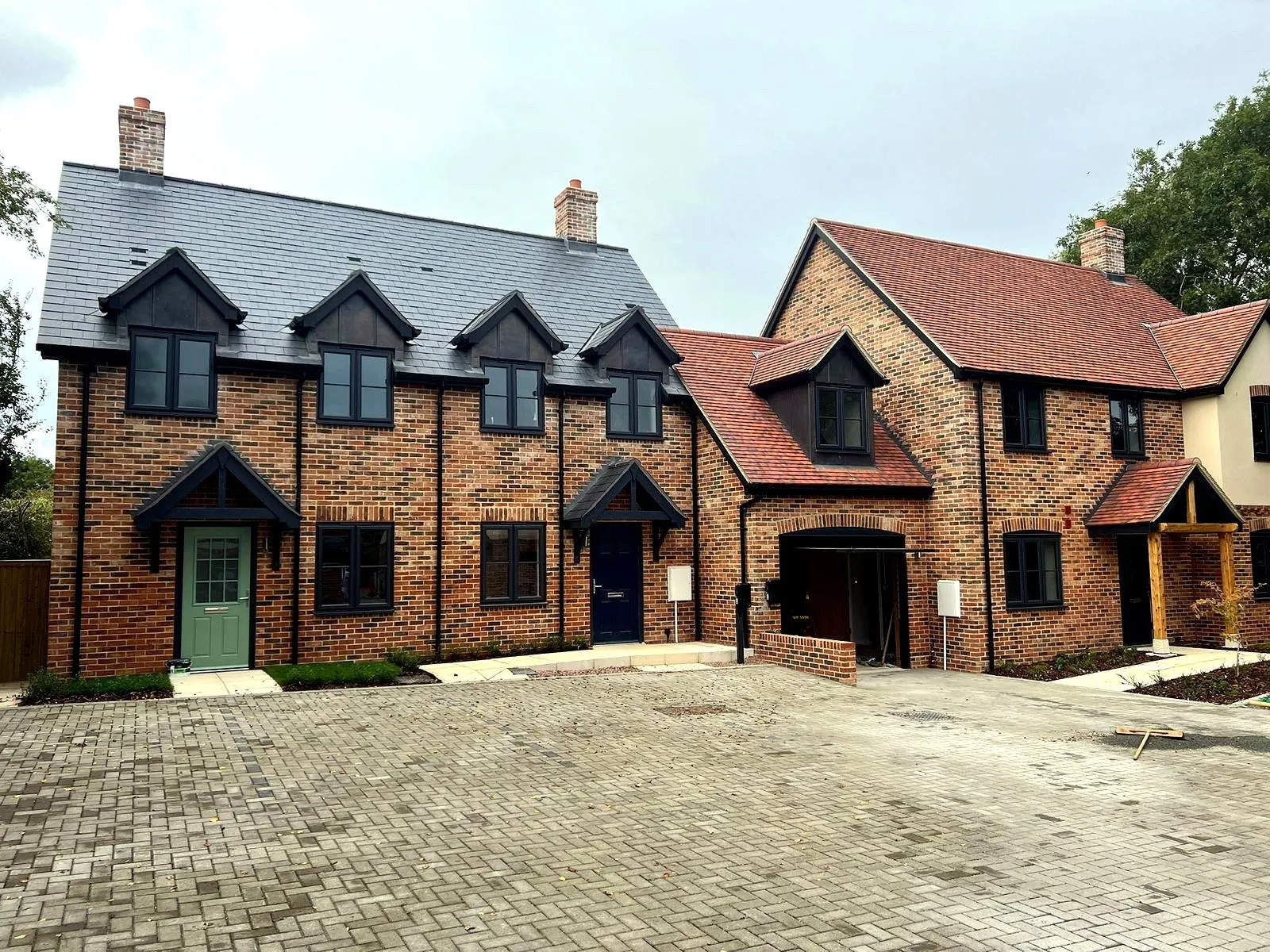 Row of completed brick townhouses built by LS Brickwork Ltd