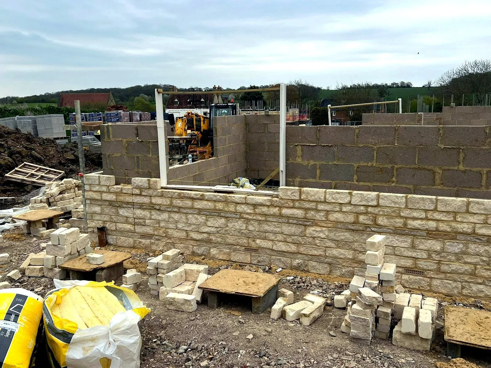 Finished Cotswold stone boundary wall built by LS Brickwork Ltd