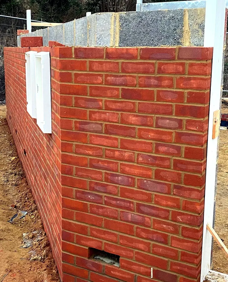 Brick boundary wall under construction